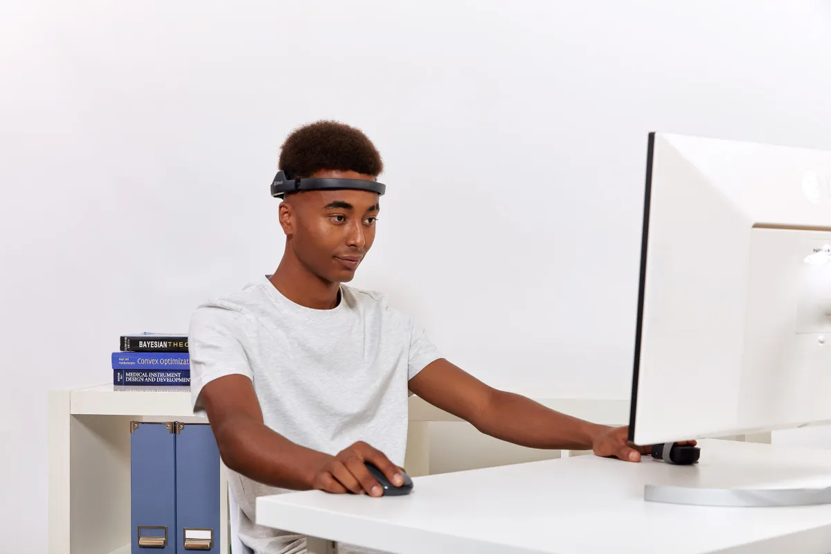 Participant wearing Bitbrain Air dry EEG and the Ring in a laboratory