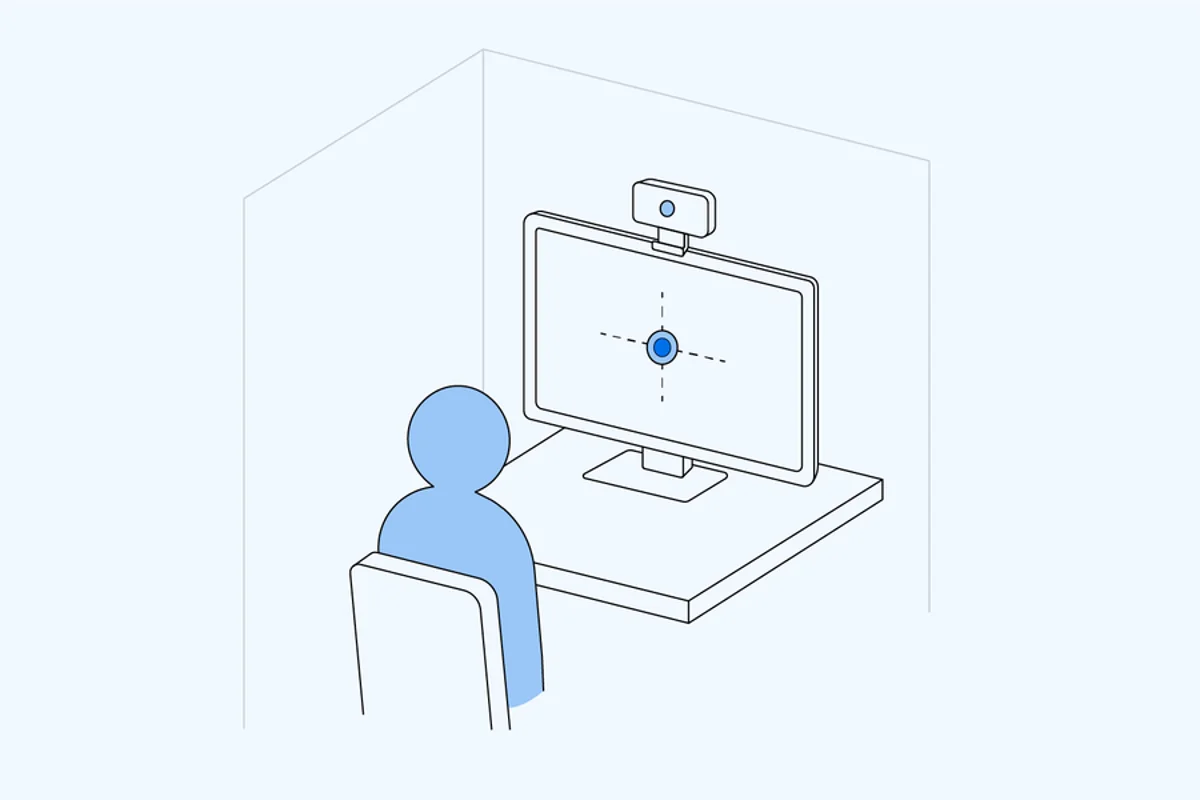Illustration of a participant at a monitor with a webcam mounted above the screen
